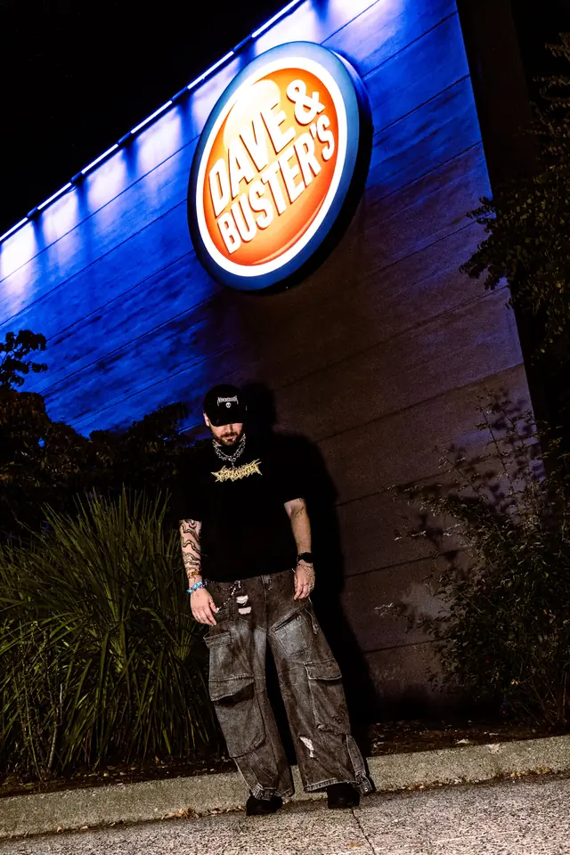 NOMOREDEATH outside Dave & Buster's at night